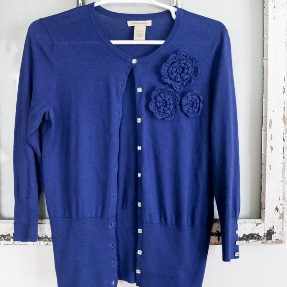 Royal blue fitted cardigan with crochet flower